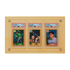 Product photograph of the Crafti Comics Legacy 3-Card Frame. Backing is available as either light wood or stained wood. Frame is designed to display PSA graded sports and Pokemon cards. Museum-quality, shatter-resistant acrylic. Optional UV-protection. Hangs portrait or landscape with twin engraved mounting holes. Crafti's laser-cut layered designs provide depth without creating pressure.