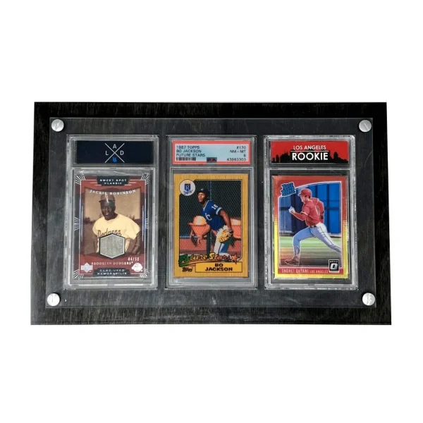 Product photograph of the Crafti Comics Legacy 3-Card Frame. Product in photo has the stained wood option. Frame is designed to display PSA graded sports and Pokemon cards. Museum-quality, shatter-resistant acrylic. Optional UV-protection. Hangs portrait or landscape with twin engraved mounting holes. Crafti's laser-cut layered designs provide depth without creating pressure.
